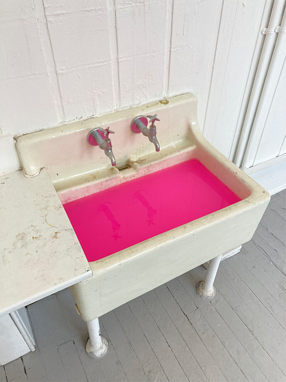 a sink full of water and opera rose acrylic paint