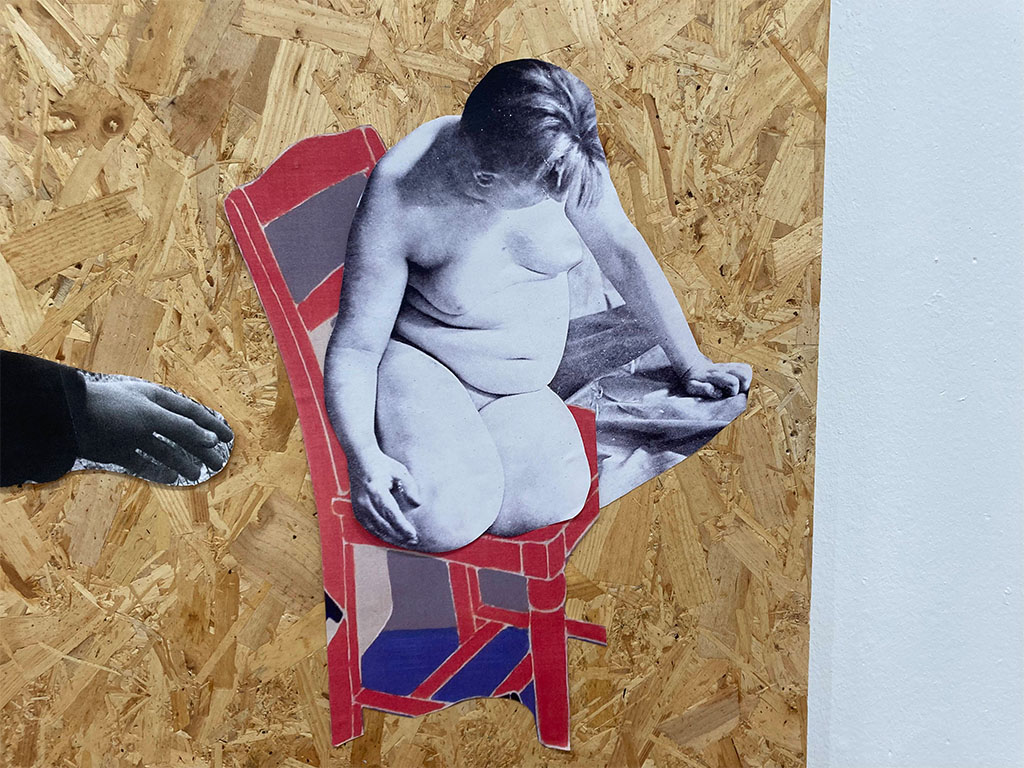 a detail image of a collage made from wood and paper depicting the autobiographer Jennie June sat on a red chair from a painting by Erica Rutherford entitled crouched figure