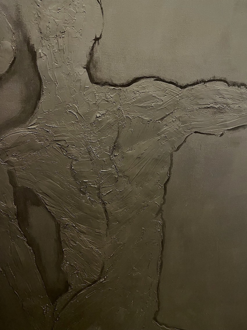 Textured detail of painting 'Winter Wonderland,' close up image of single figure.