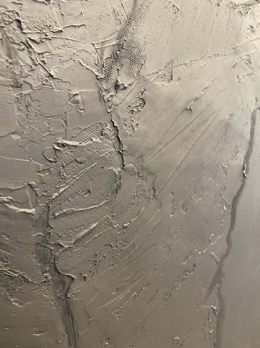 close up of textures on black painting: 'Winter Wonderland.'