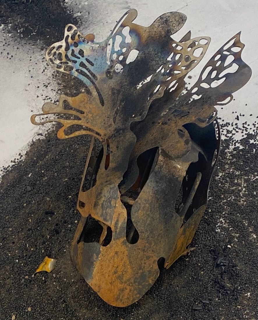 Details of a steel sculpture, situated on the floor.