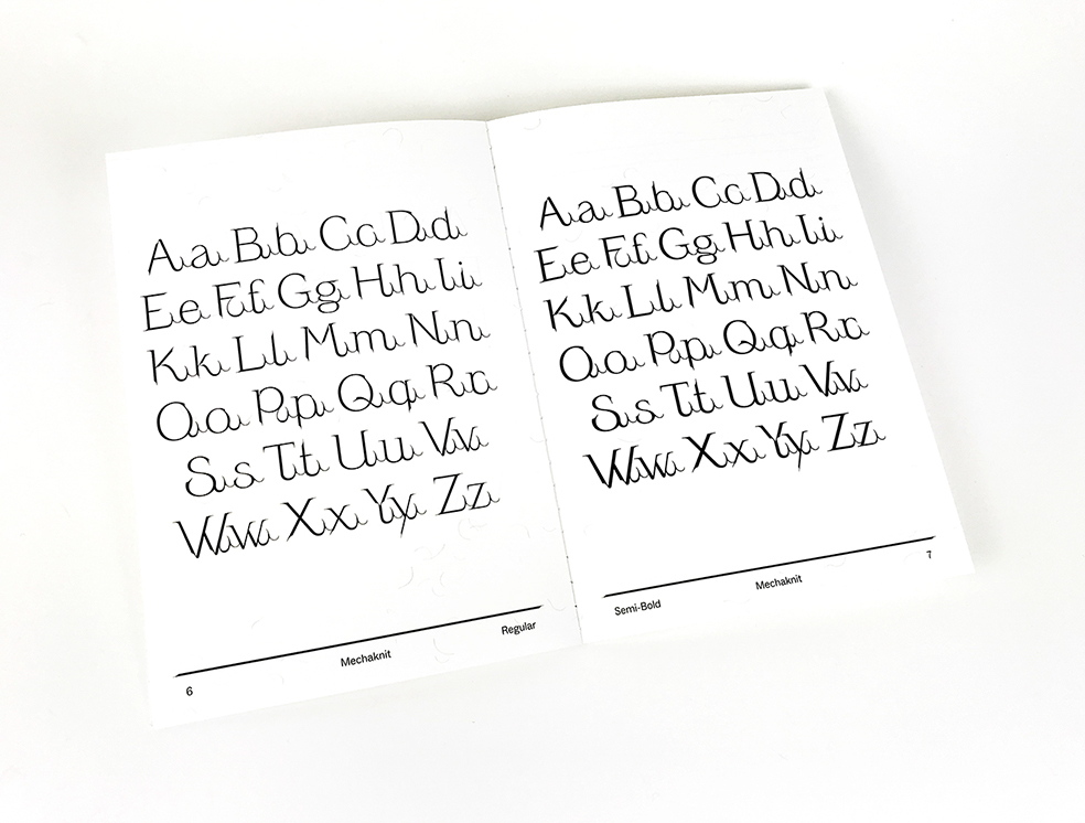 Photograph of an open double page from a font specimen