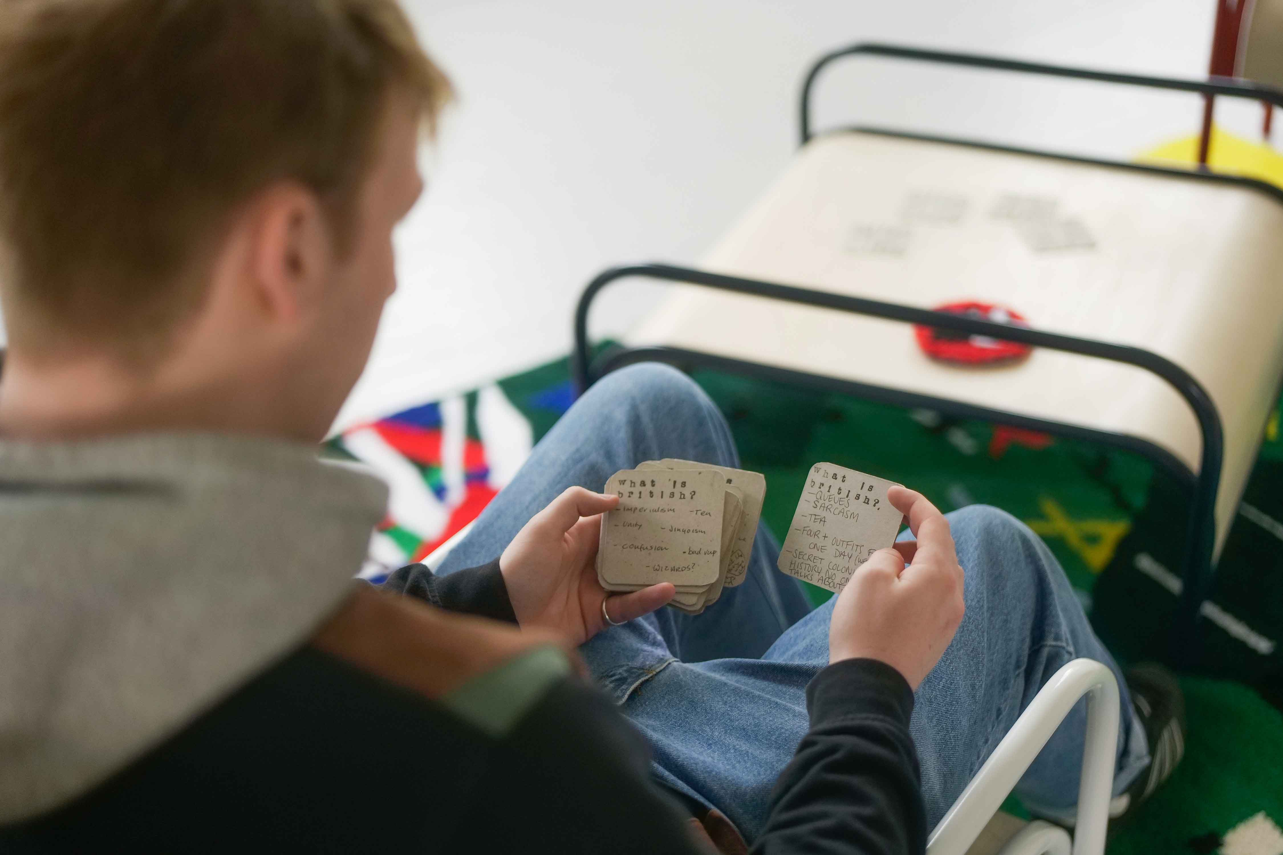 A user reading the What is British Beer Mat research prototype