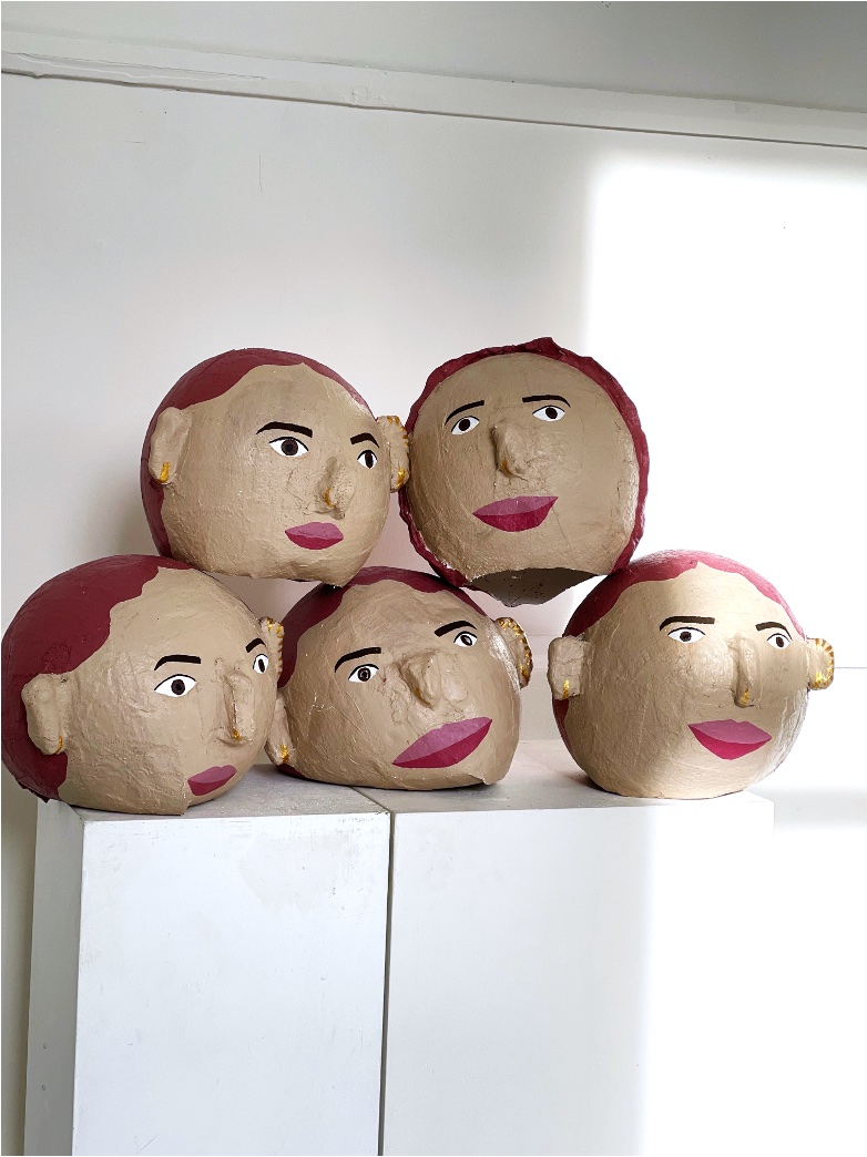 big heads stacked
