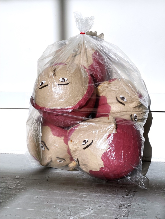 big heads in bag