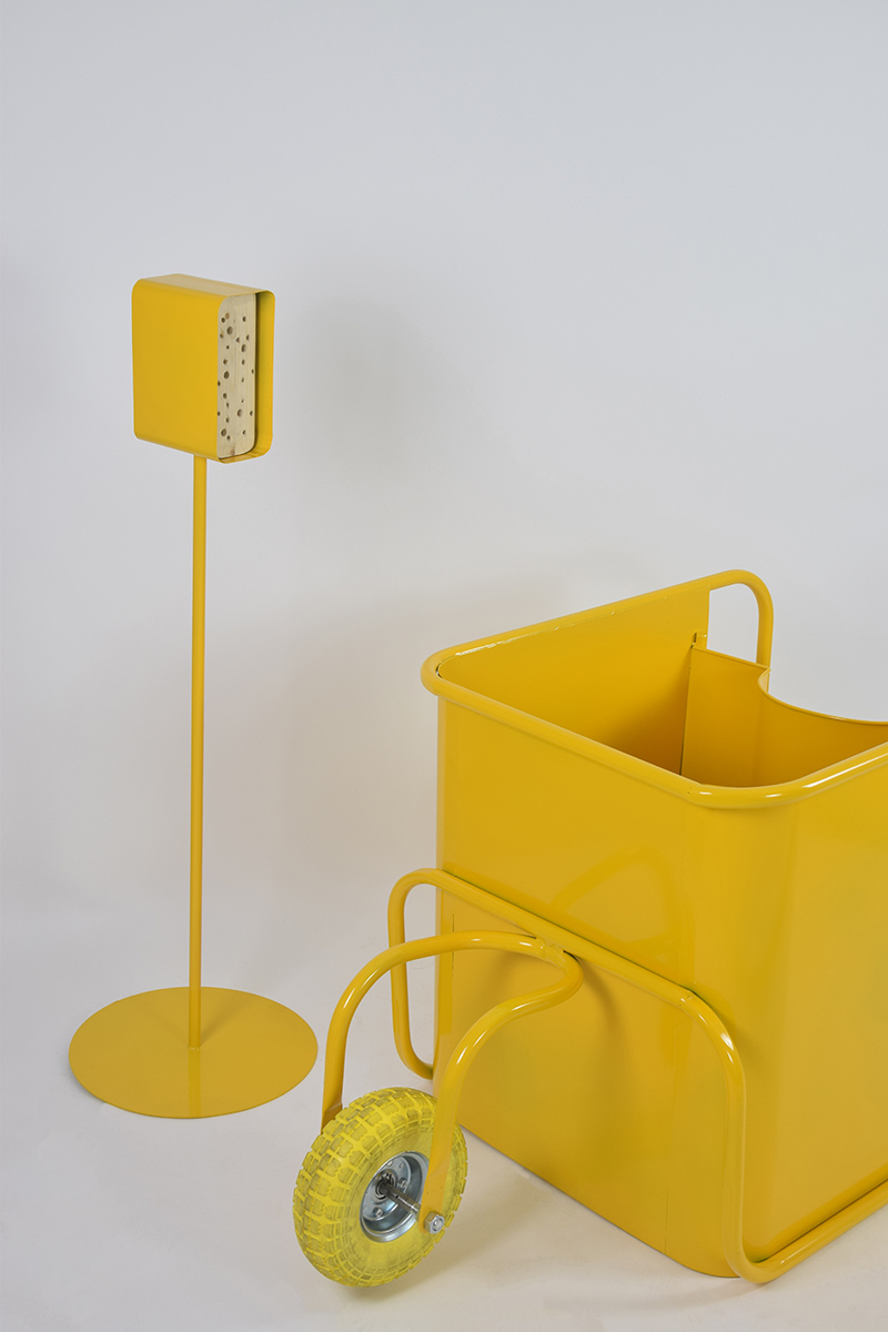 Yellow planter and matching yellow bee hotel