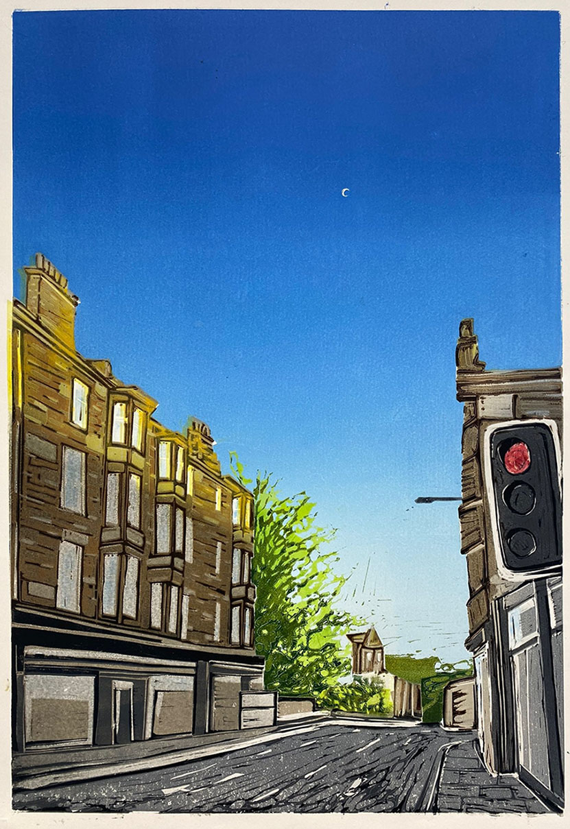Sun sets on the top of a tenement building. A traffic light turns red and a small waning moon can be seen in the sky