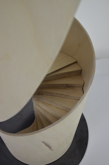 A top view of the wooden spiral, looking down the spiral staircase within it
