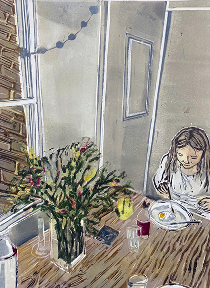 A woman sits eating breakfast at the table. There are flowers, a mug and a bottle on the table