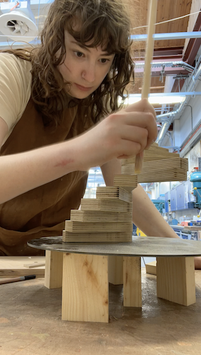 Katherine is gluing elements of the spiral staircase together