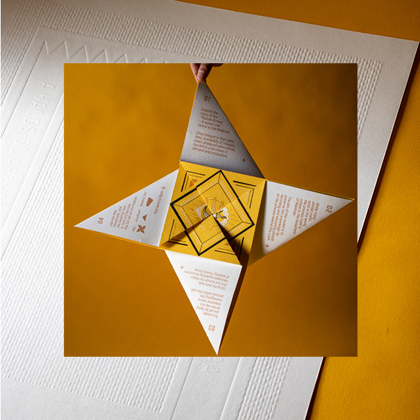 Screenprinted artwork folded into a victorian puzzle purse